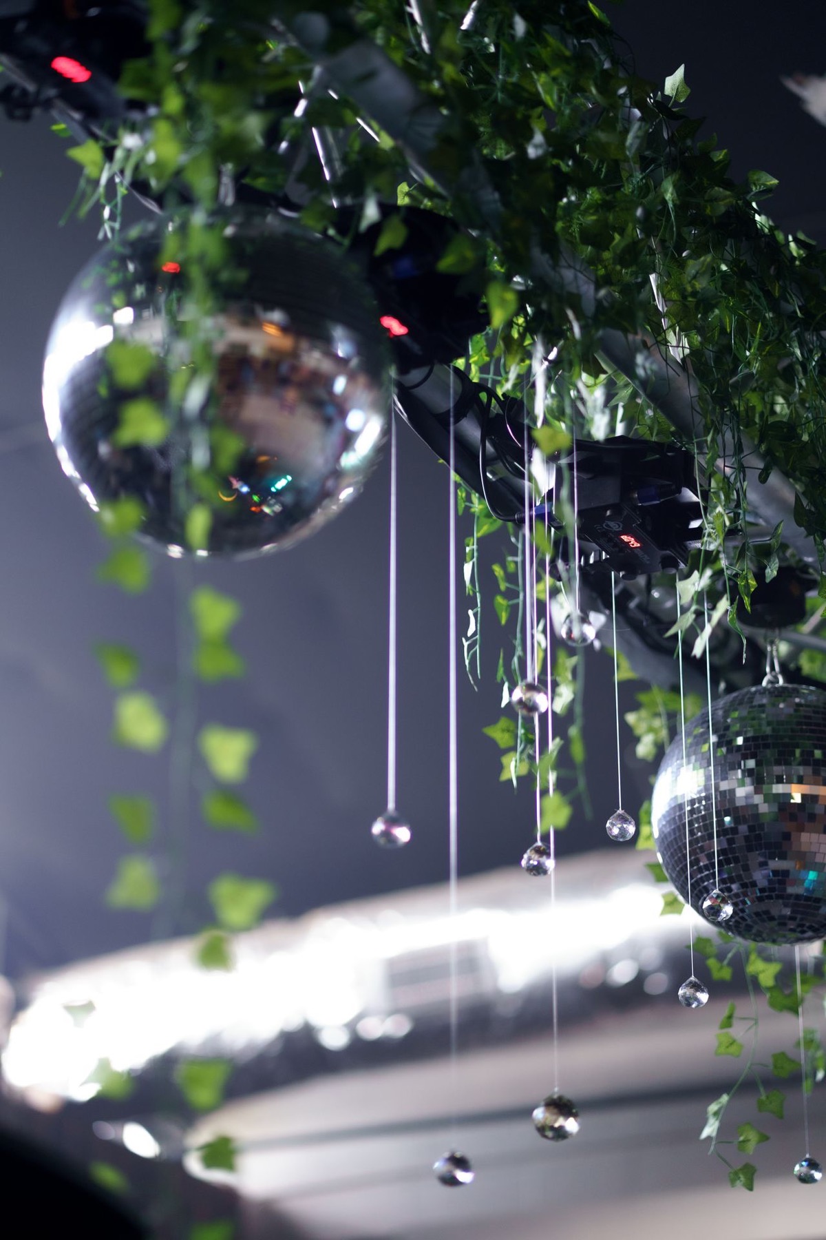Disco balls and ivy at Stardust Garage
